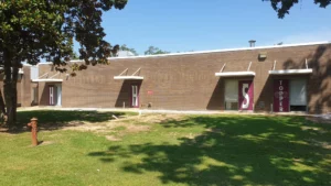 Maroon door wraps with letters spelling Hilltopper on a school