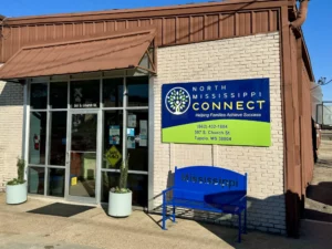 North Mississippi Connect wall sign beside a storefront entrance